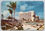 Americana Beach Hotel, Miami Florida View Of Pool And Loungers. Fixed Price $7.97.
