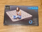 The Sharper Image Flocked Air Bed With Pump - Queen Size. Fixed Price $44.99.